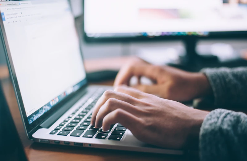 A business owner checking local search results on a laptop